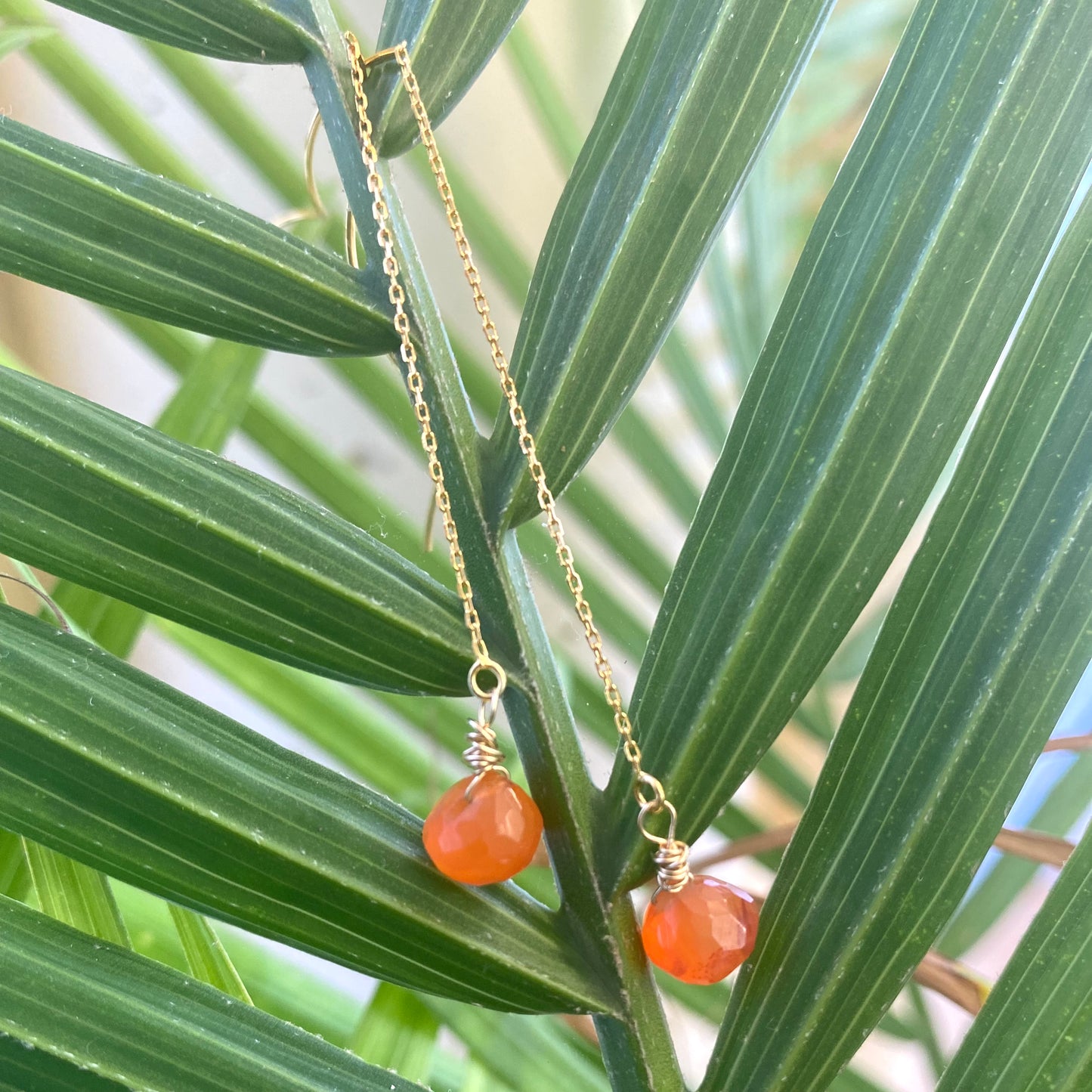 Carnelian threader earrings with briolettes, handmade in Canada, vibrant and lightweight design.