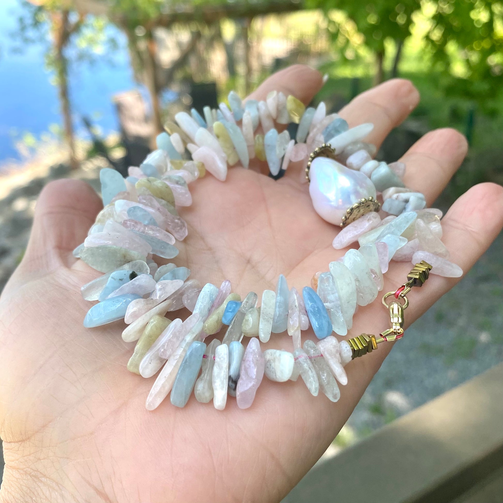 Morganite aquamarine necklace featuring natural gemstones and organic shapes in pastel colors.