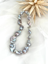 Load image into Gallery viewer, Baroque pearl necklace with silver details, featuring large silver-grey pearls with iridescent undertones.
