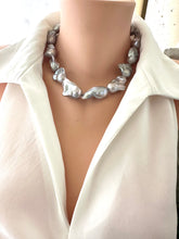Load image into Gallery viewer, Baroque pearl necklace with silver details displayed on a mannequin, handcrafted in Canada.
