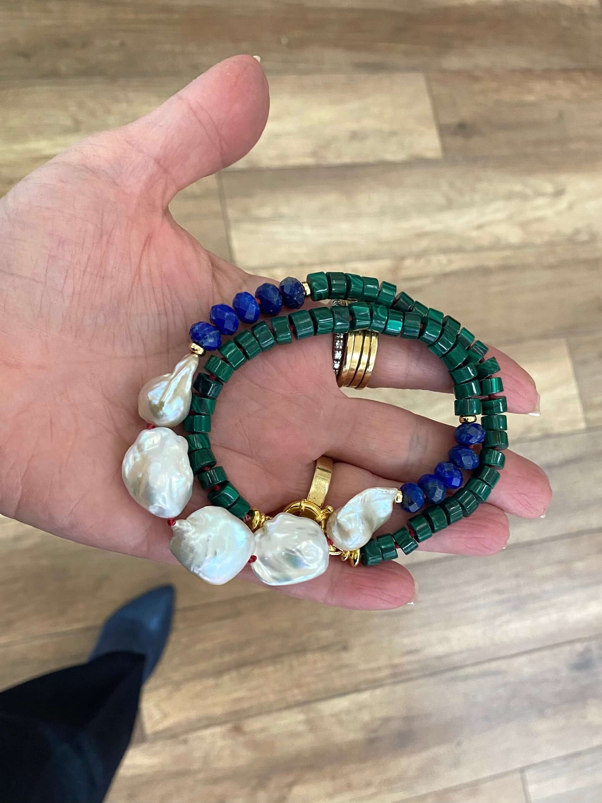 Malachite Lapis Lazuli Baroque Pearl Necklace viewed from top in hand, handmade gemstone jewelry from Canada.