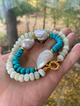 Load image into Gallery viewer, Close up of green jade and turquoise pearl necklace in hand, natural light
