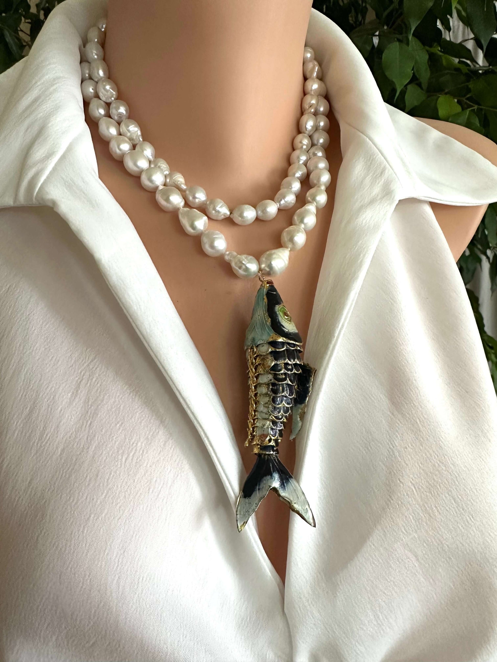 Fish pendant pearl necklace featuring a cloisonné fish pendant with baroque pearls, showcasing elegant craftsmanship.