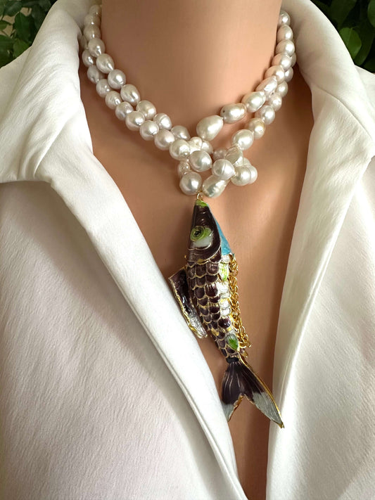Koi fish pearl necklace featuring baroque pearls and a vibrant koi fish pendant worn by a mannequin.