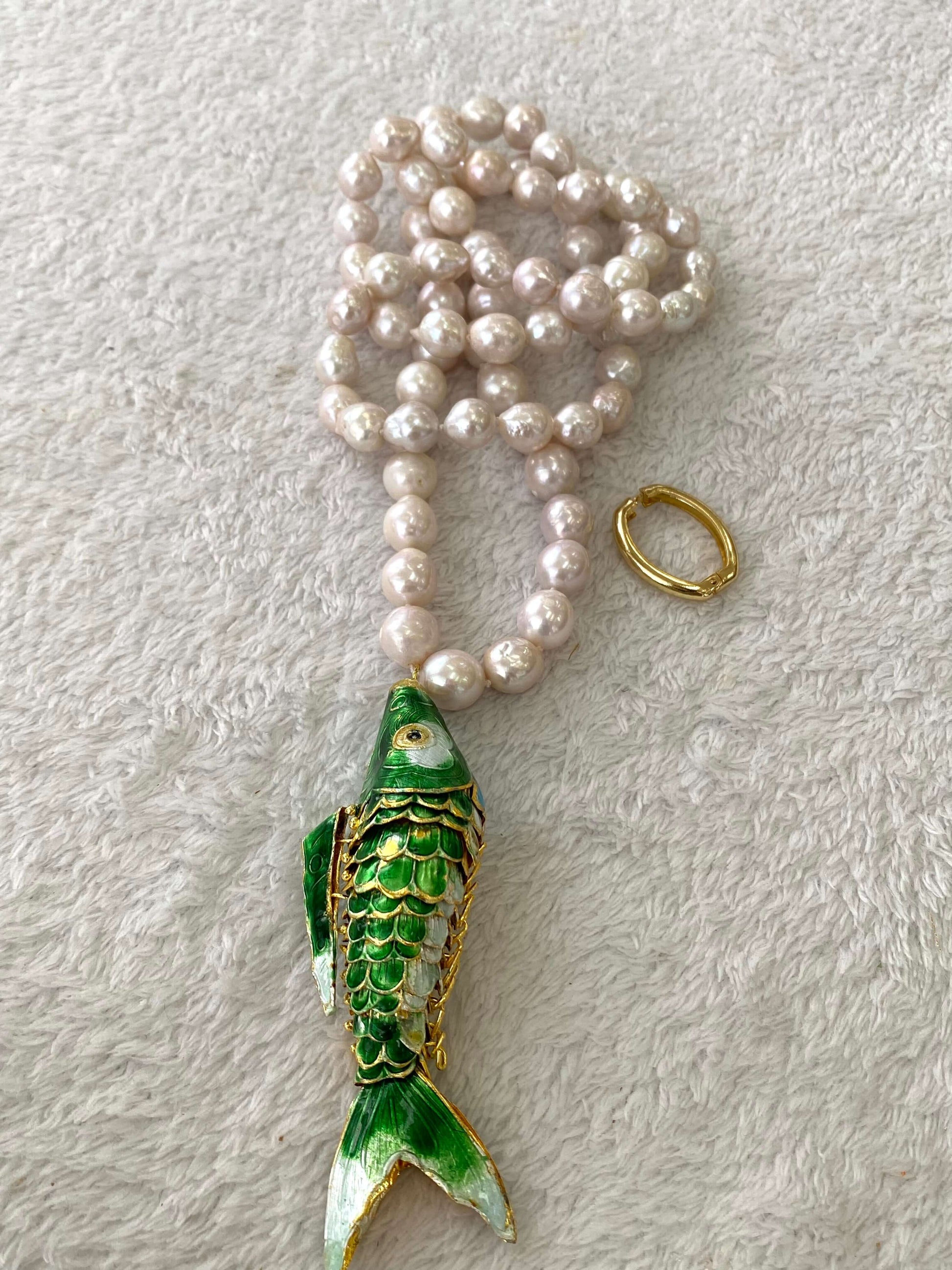 Cloisonné fish pearl necklace featuring hand knotted baroque pearls and a colorful fish pendant.