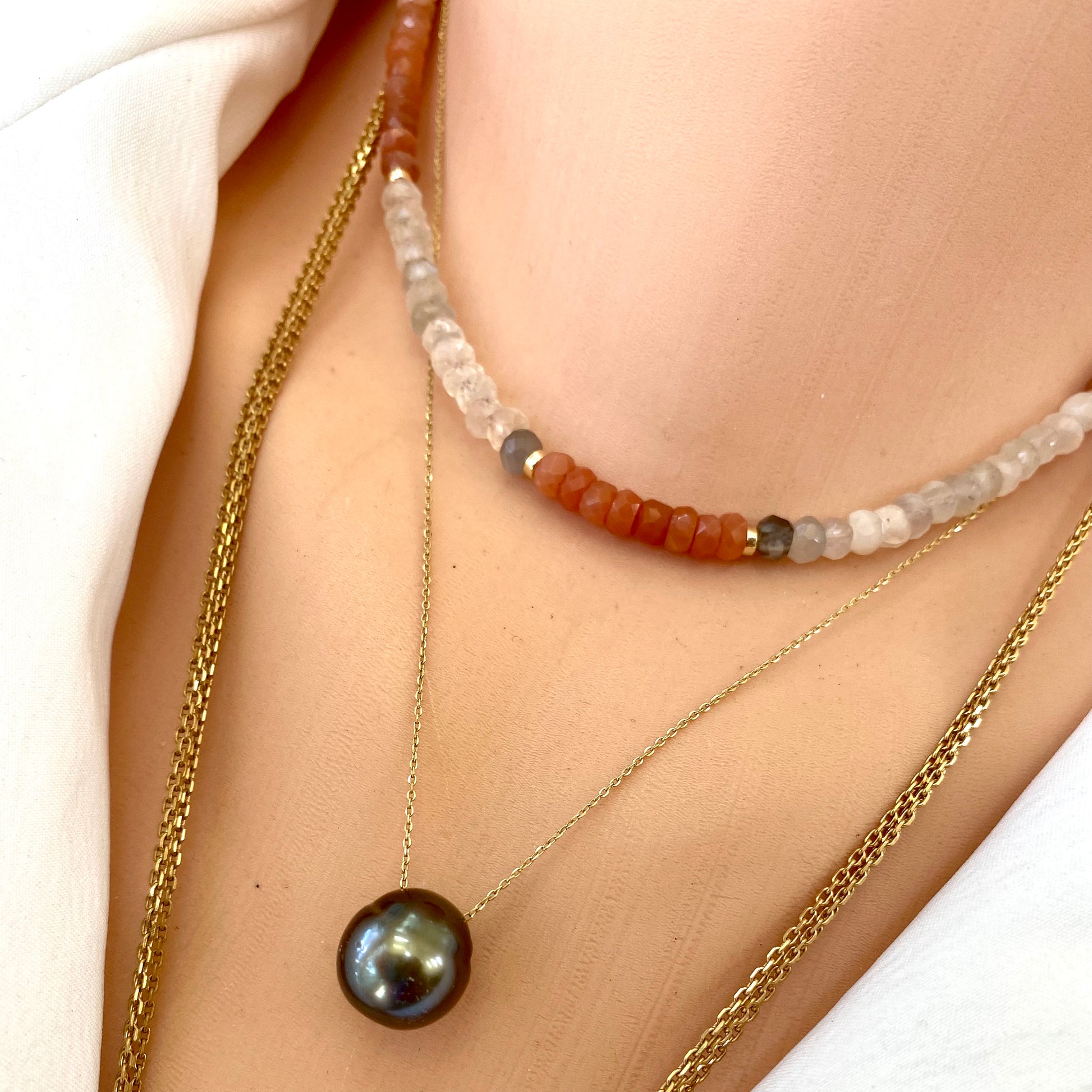 Moonstone choker necklace featured with multi moonstone beads and a pearl pendant for an elegant look.