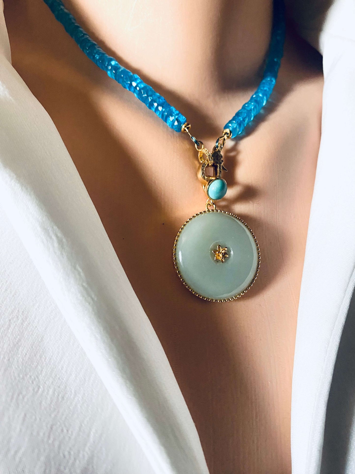 Blue topaz beaded necklace with gold vermeil pavé clasp showcasing vibrant beads and elegant pendant.