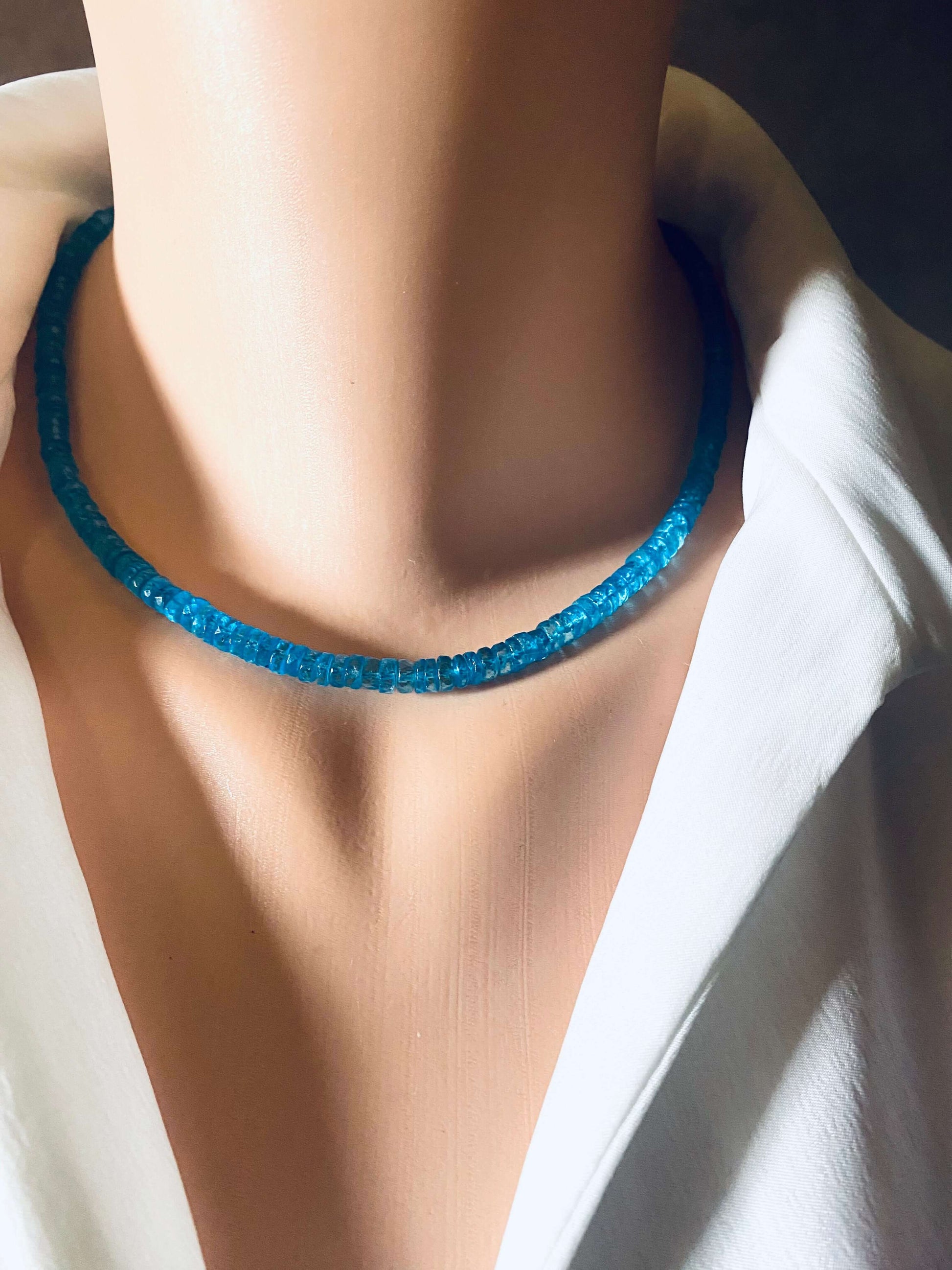 Blue topaz beaded necklace showcasing vibrant color and craftsmanship on a mannequin neck.