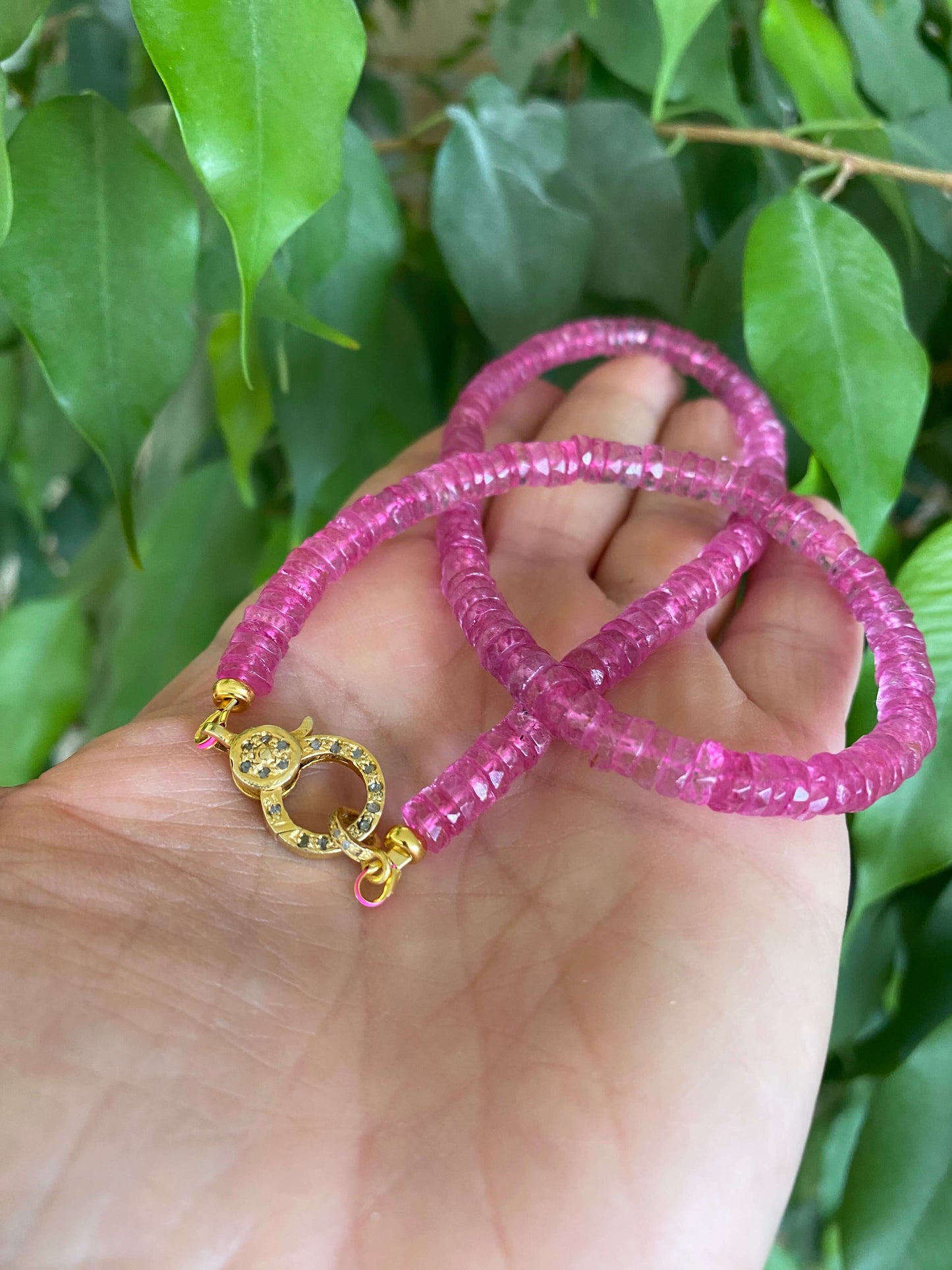 Pink topaz beaded necklace with gold vermeil pavé clasp, showcasing vibrant hot pink topaz beads.