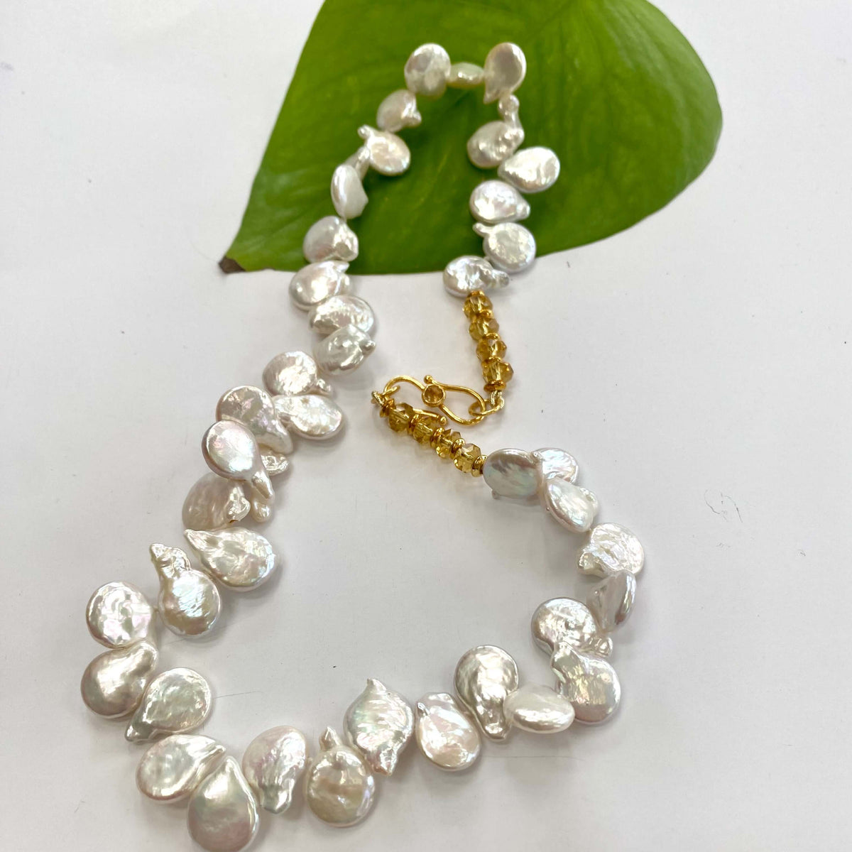 Keshi pearl necklace featuring AAA-quality freshwater pearls with a gold clasp, showcasing its elegant design and organic charm.