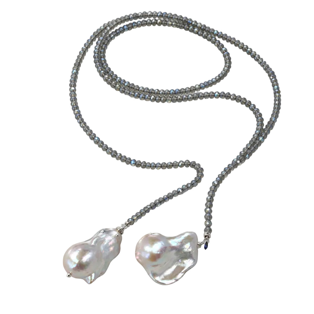 Labradorite and Baroque Pearl Necklace displayed on a silky surface with an abalone shell.