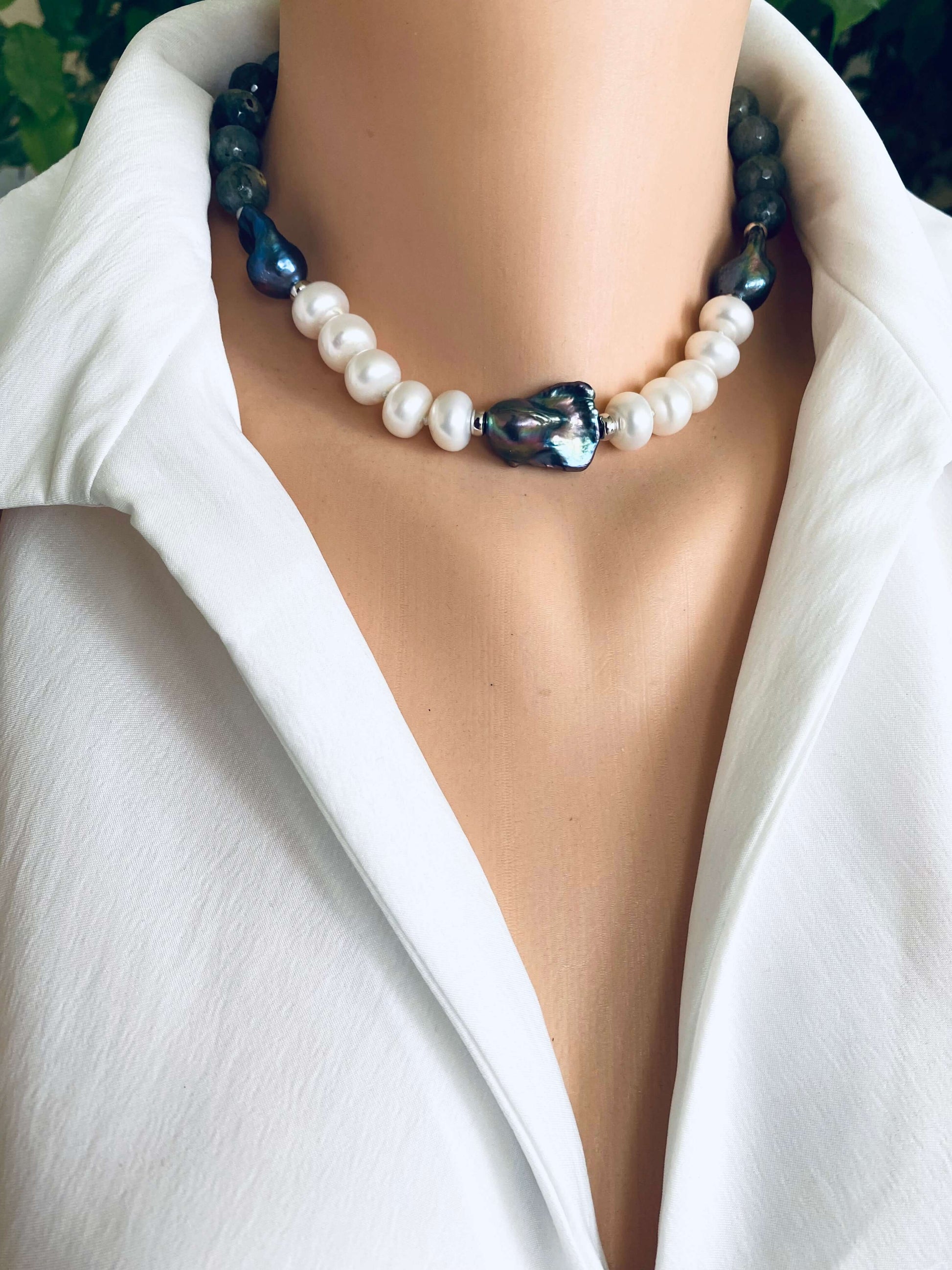 Labradorite pearl necklace featuring baroque and coin pearls displayed elegantly on a mannequin's neck.