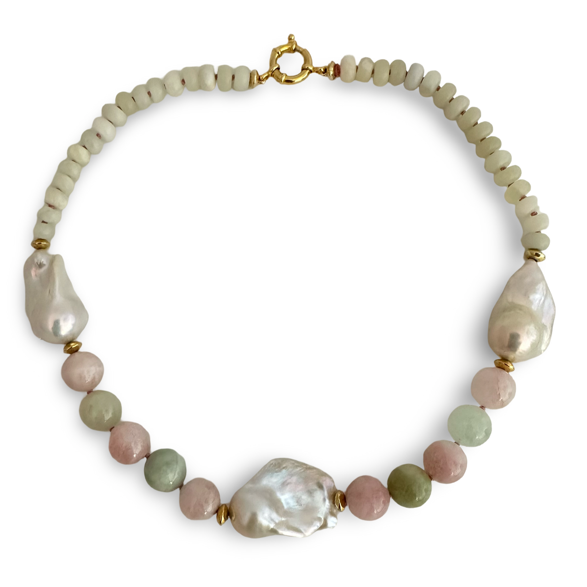 A beaded necklace featuring large, irregular white baroque pearls accented by small large beads in pale pink, sage green, and cream, finished with a gold clasp on a white background.