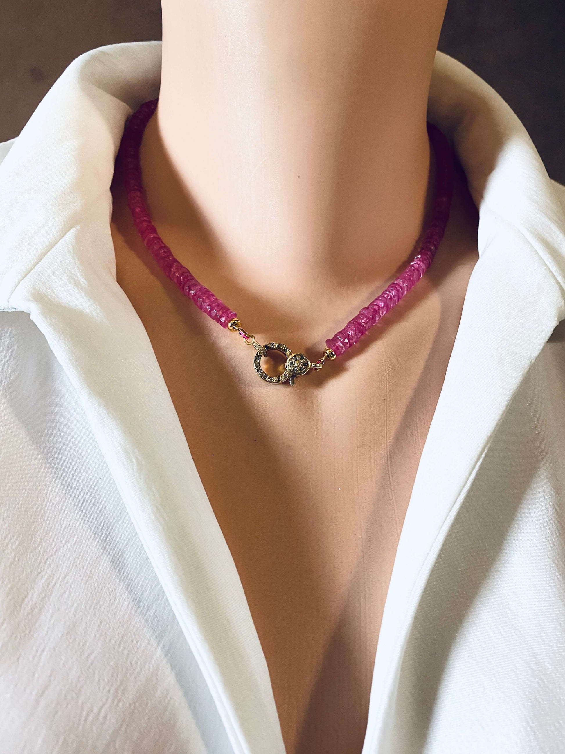 Pink topaz beaded necklace featuring gold vermeil pavé clasp, showcased on a mannequin against a white shirt.