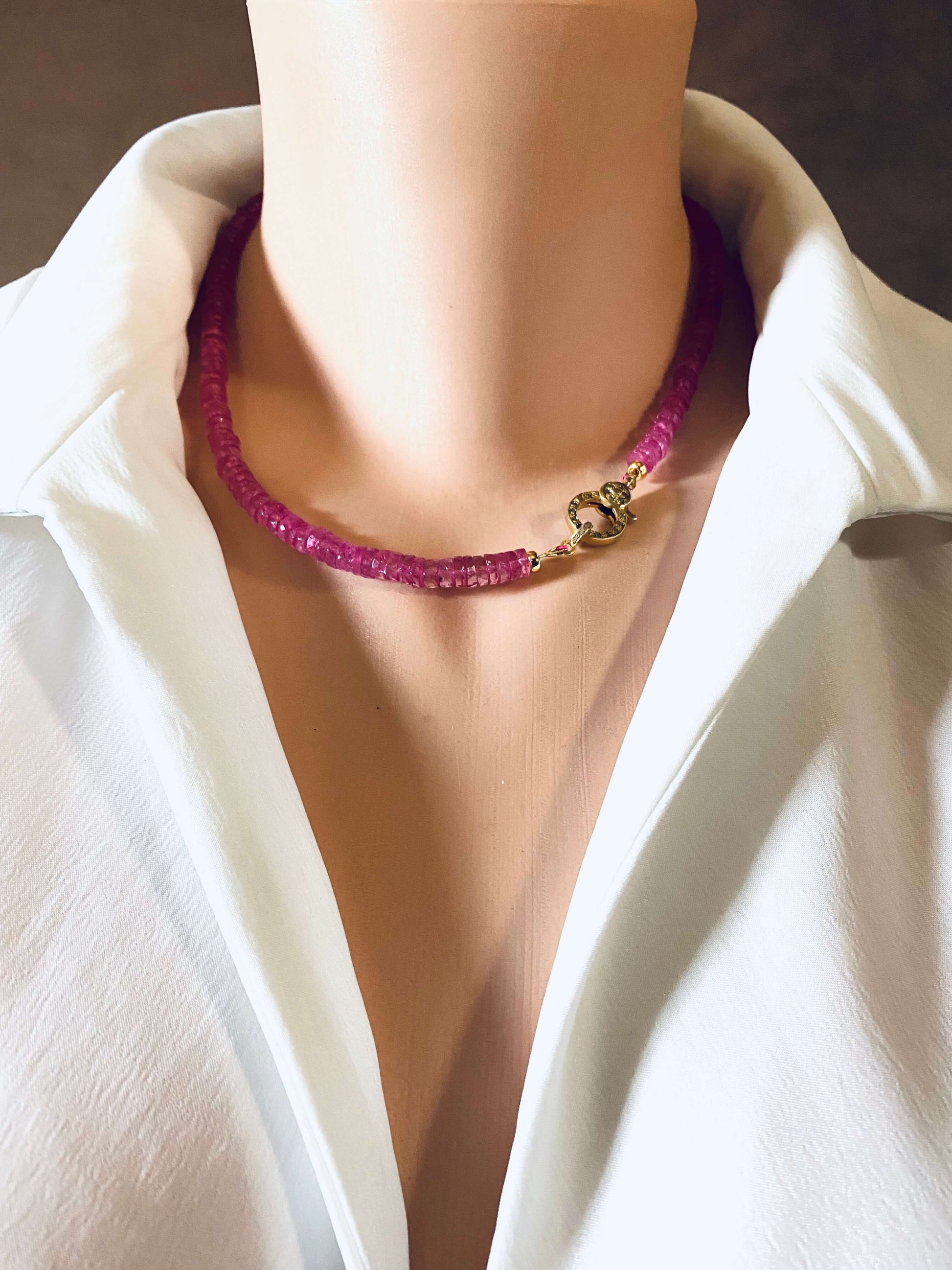 Pink topaz beaded necklace with gold vermeil pavé clasp displayed on a mannequin wearing a white shirt.