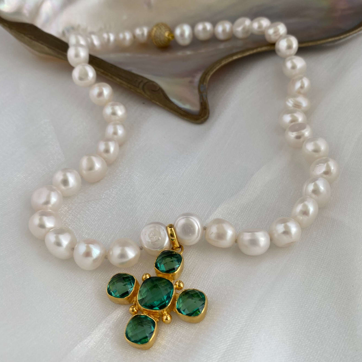 Potato pearl necklace with cross pendant featuring gold plated Green Quartz and hand-knotted freshwater pearls.