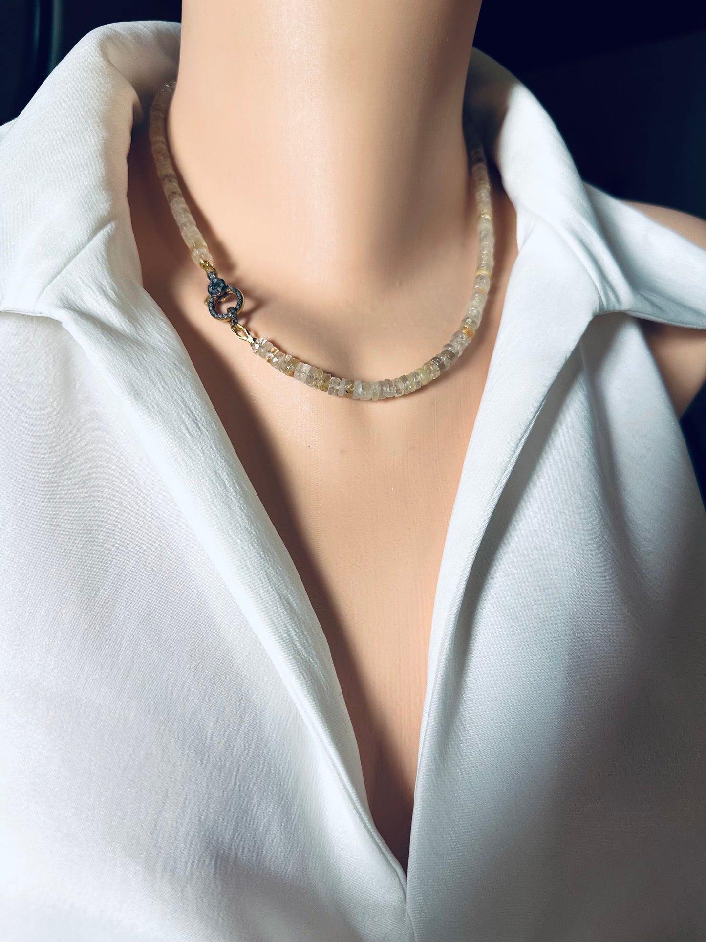 Necklace on a mannequin with a white shirt