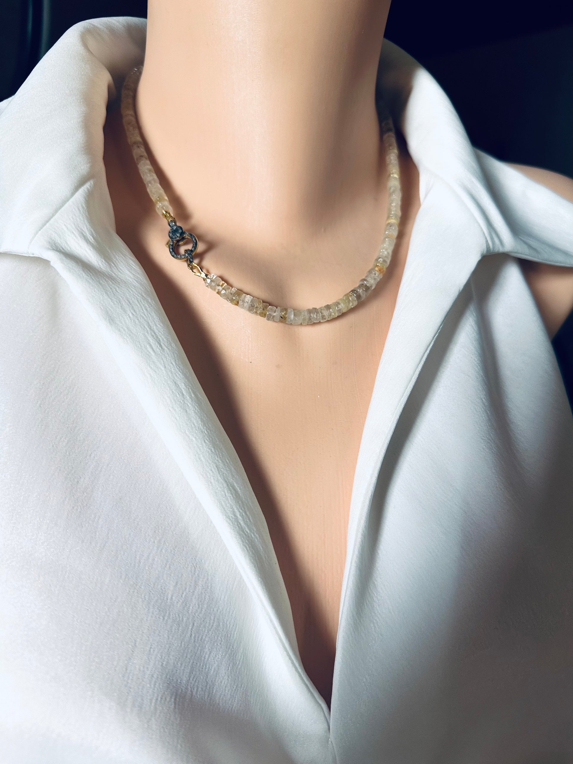 Necklace on a mannequin with a white shirt