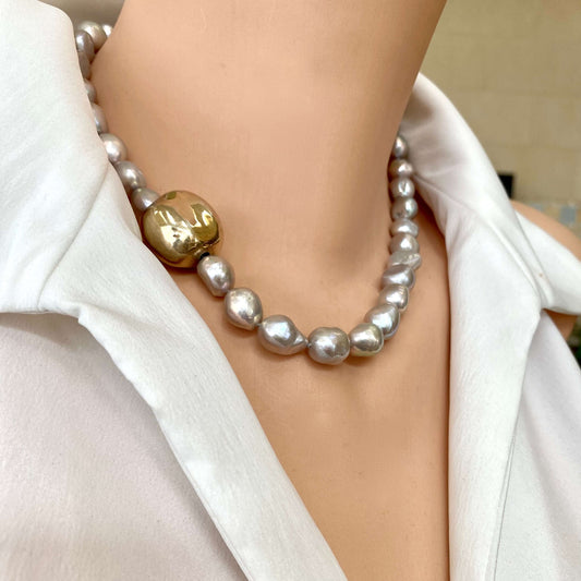 Grey pearl necklace with gold marine clasp styled close to neckline with luminous grey pearls