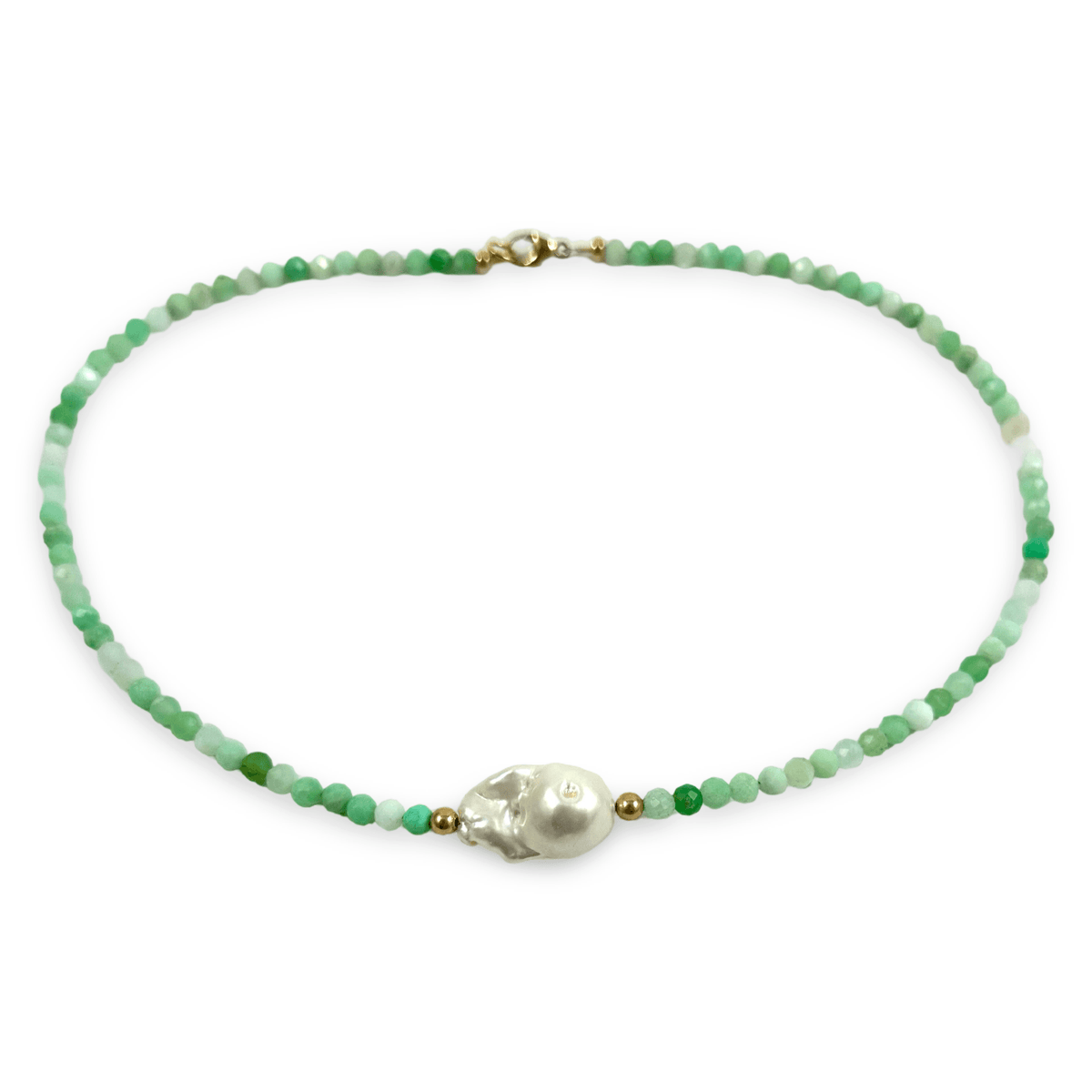 A beaded necklace featuring faceted green and white beads, a central white baroque pearl, and small gold spacer beads, displayed on a clean white background.