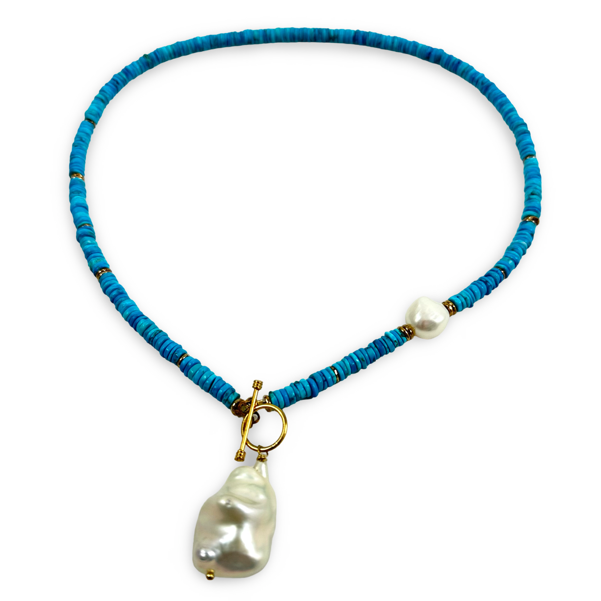A turquoise beaded necklace with a gold toggle clasp and a large, irregular white baroque pearl pendant, displayed on a clean white background.