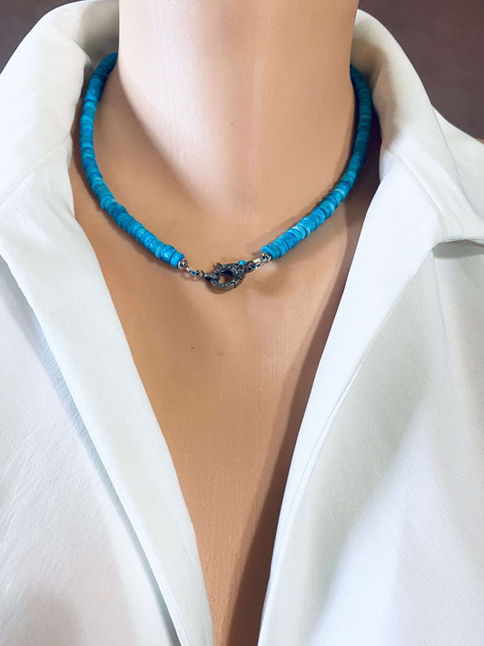Turquoise howlite beaded necklace with oxidized silver pavé clasp displayed on a mannequin.