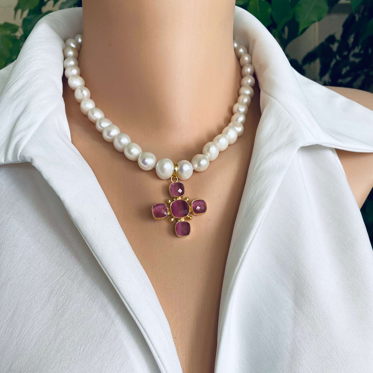 White potato pearl necklace with cross pendant showcasing white freshwater pearls and a pink gemstone cross centerpiece.