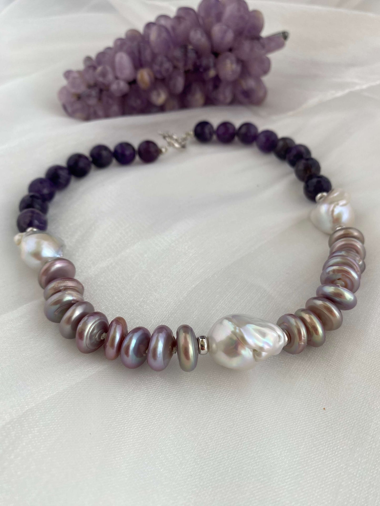 Garnet pearl necklace with Baroque and coin pearls, featuring rich gemstone colors and organic pearl elegance.