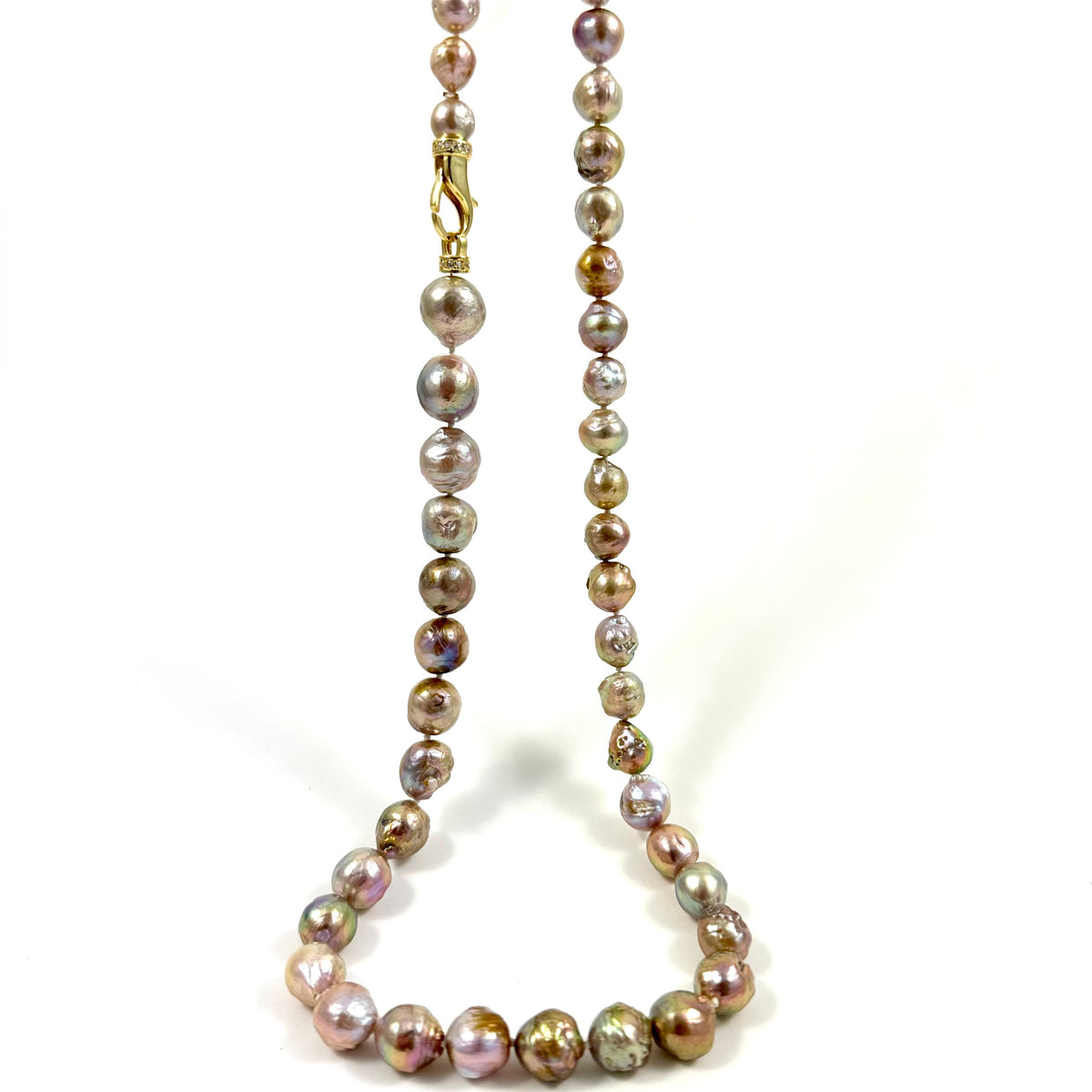 A beaded necklace made of iridescent baroque pearls in shades of bronze, gold, and pink, with a small gold lobster clasp, shown on a white background.