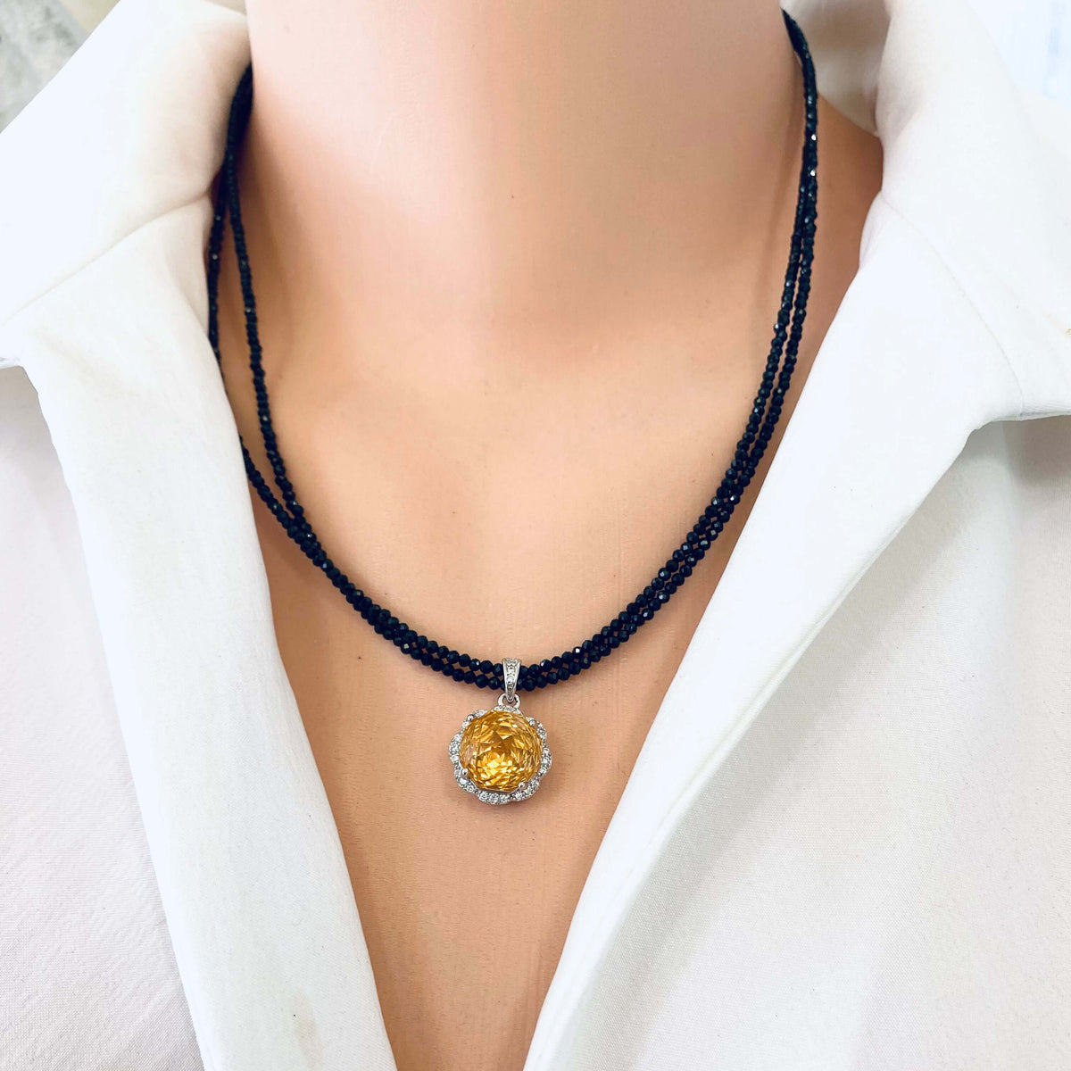 Front view of black spinel and citrine pendant necklace, 19 inch length display