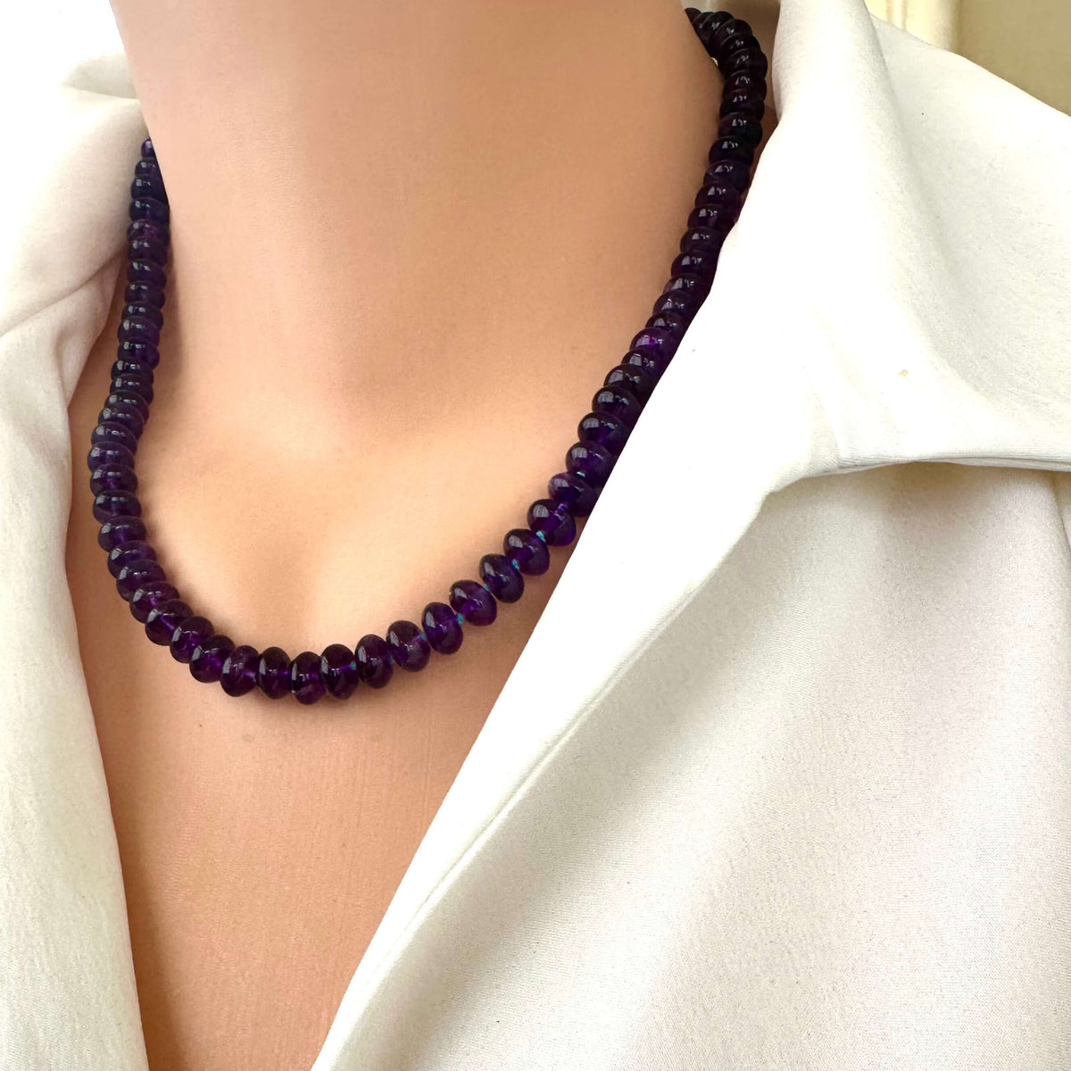Amethyst beaded necklace worn on mannequin for scale and style reference
