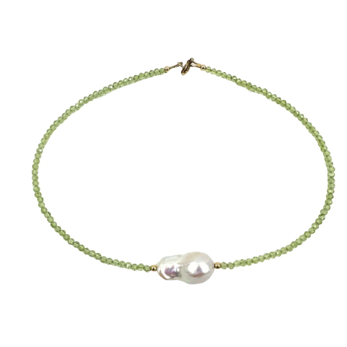 A delicate beaded necklace featuring light green faceted beads and a central cluster of a white baroque pearl, finished with a small gold clasp, shown on a plain white background.