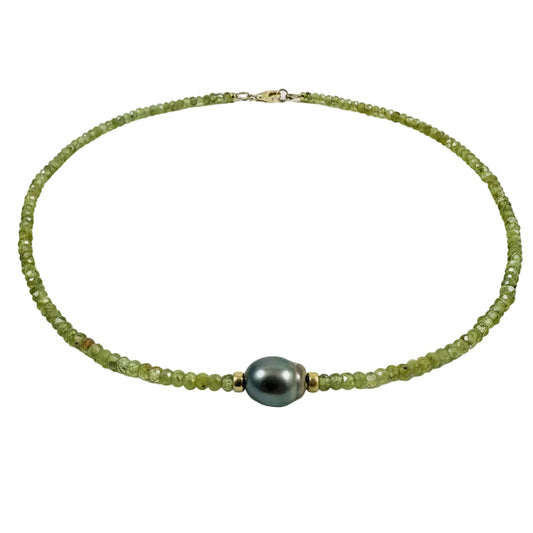 A beaded necklace made of light green peridot beads with a central Tahitian pearl and small gold spacer beads, displayed on a light gray background with text reading 'Peridot+Tahitian Pearl' below.