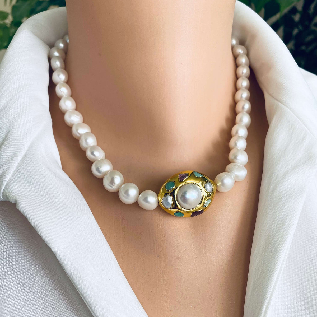 White pearl necklace with gold accent featuring hand-knotted freshwater pearls and an 18kt gold-plated focal accent.