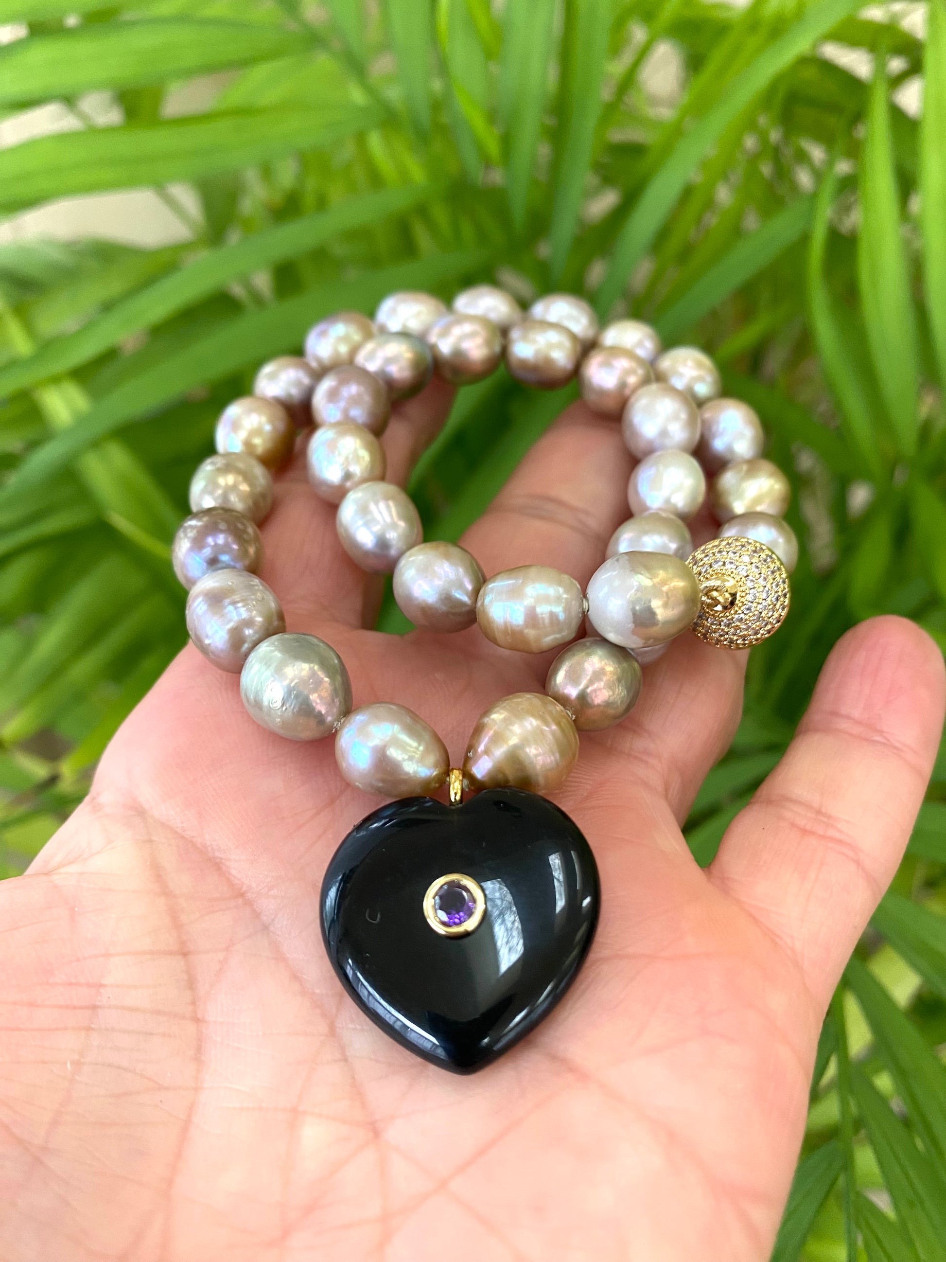 golden green 10m rice pearl choker necklace up close on hand