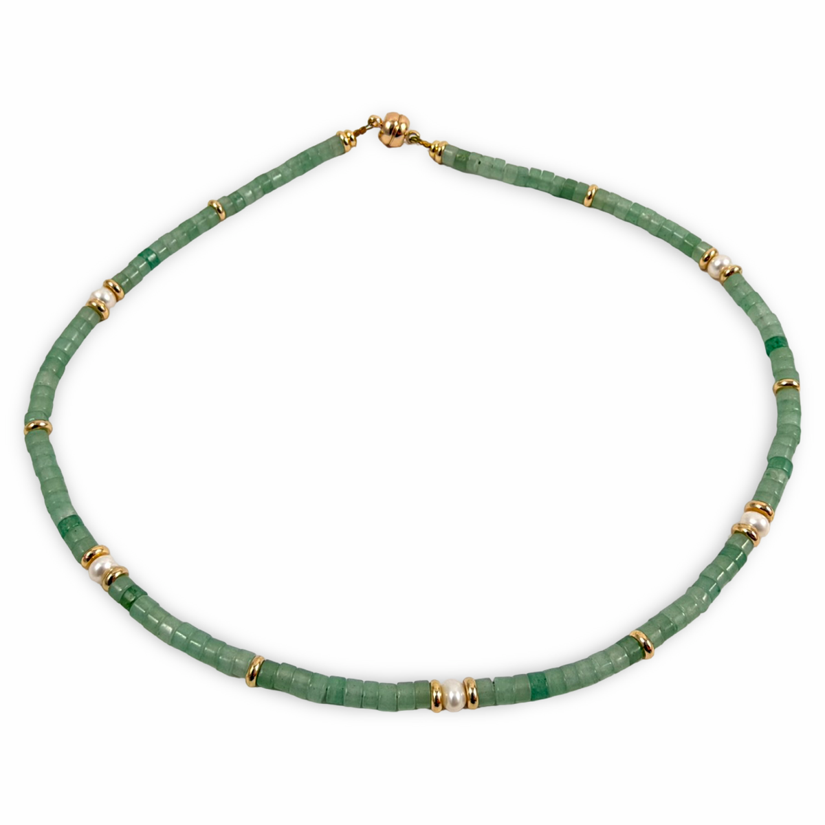 A beaded necklace made of faceted green stone beads separated by small gold spacer rings, shown on a plain white background.