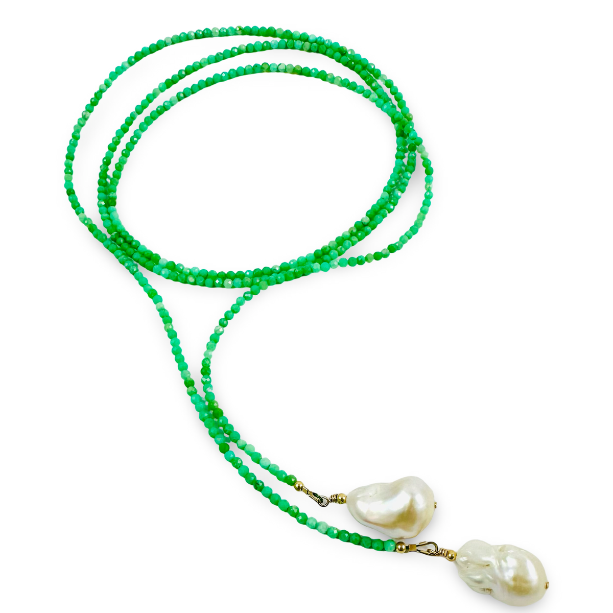 A beaded necklace featuring vibrant green faceted beads and two large, irregular white baroque pearls at the ends, accented with small gold-toned hardware, shown on a plain white background.