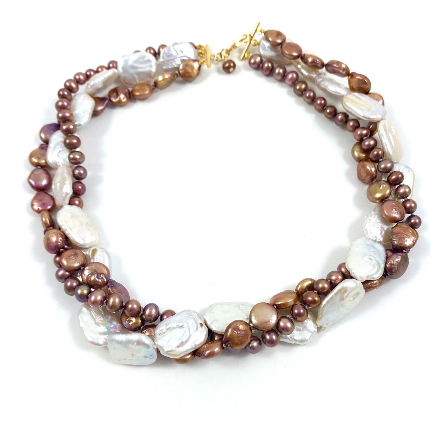 A multi-strand beaded necklace featuring brown and bronze pearls, white baroque pearls, and small gold spacer beads, completed with a gold clasp, shown on a plain white background.