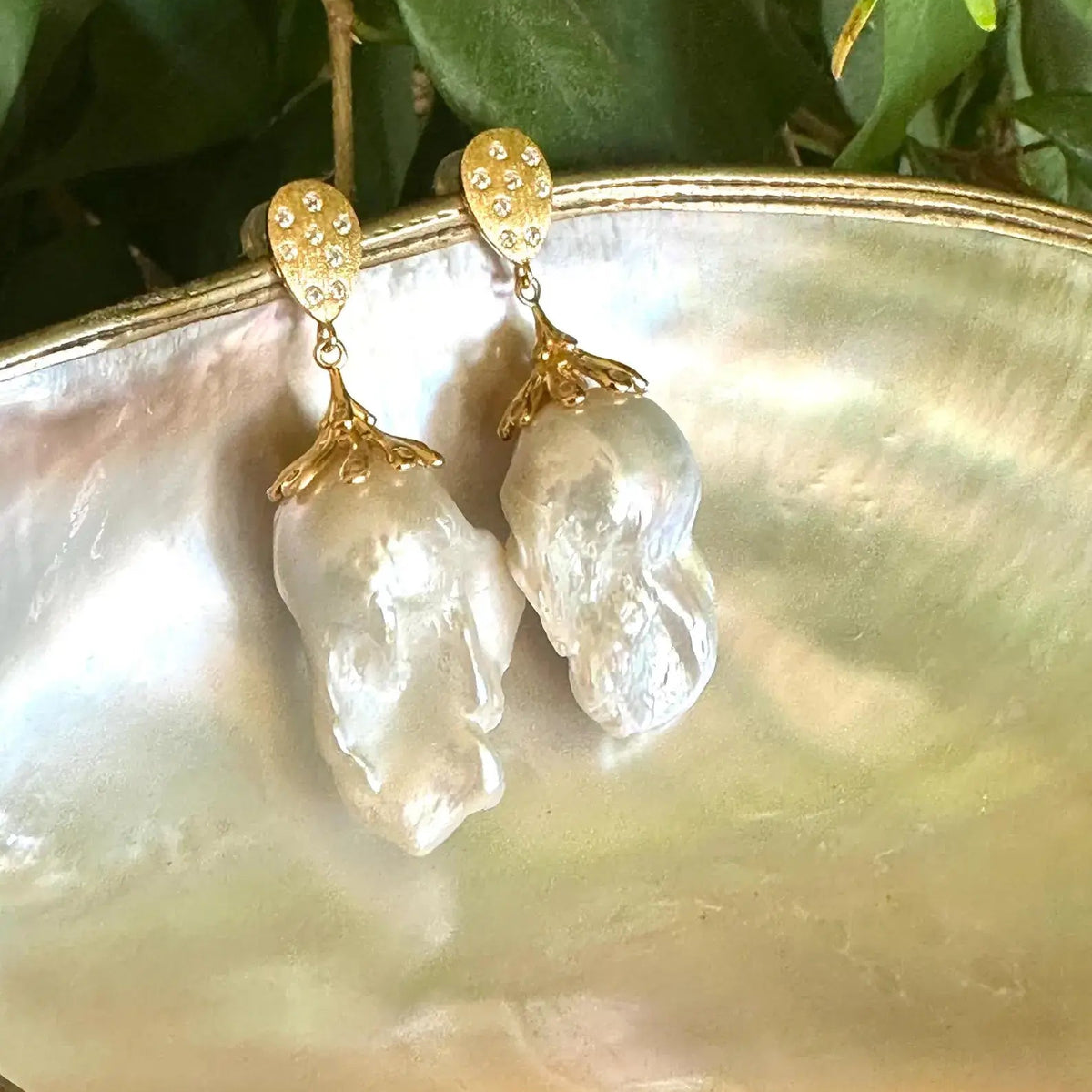 Baroque Pearl Gold Vermeil Earrings photographed with green leaves — gold vermeil and baroque pearls handcrafted by Loulia Pearl Jewelry