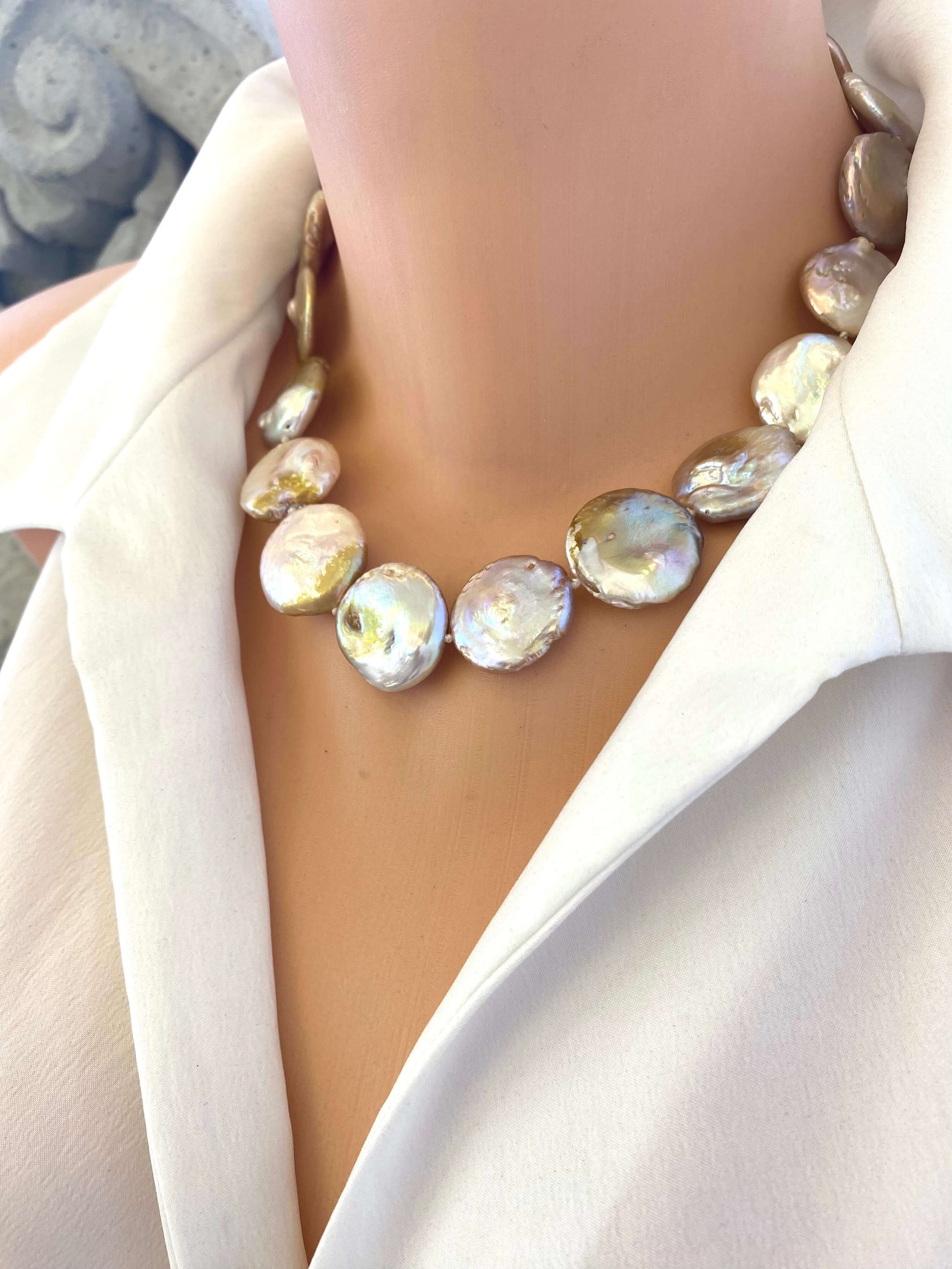 Handcrafted large coin pearl necklace side angle on mannequin, elegant design