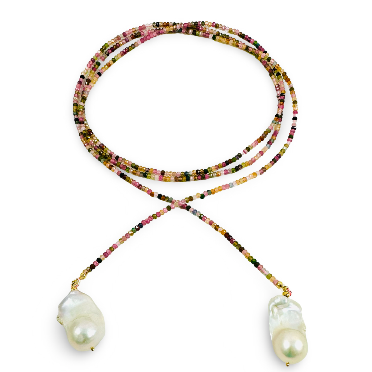 A long-strand multi tourmaline beaded necklace with large baroque pearls at the ends, displayed on a clean white background.