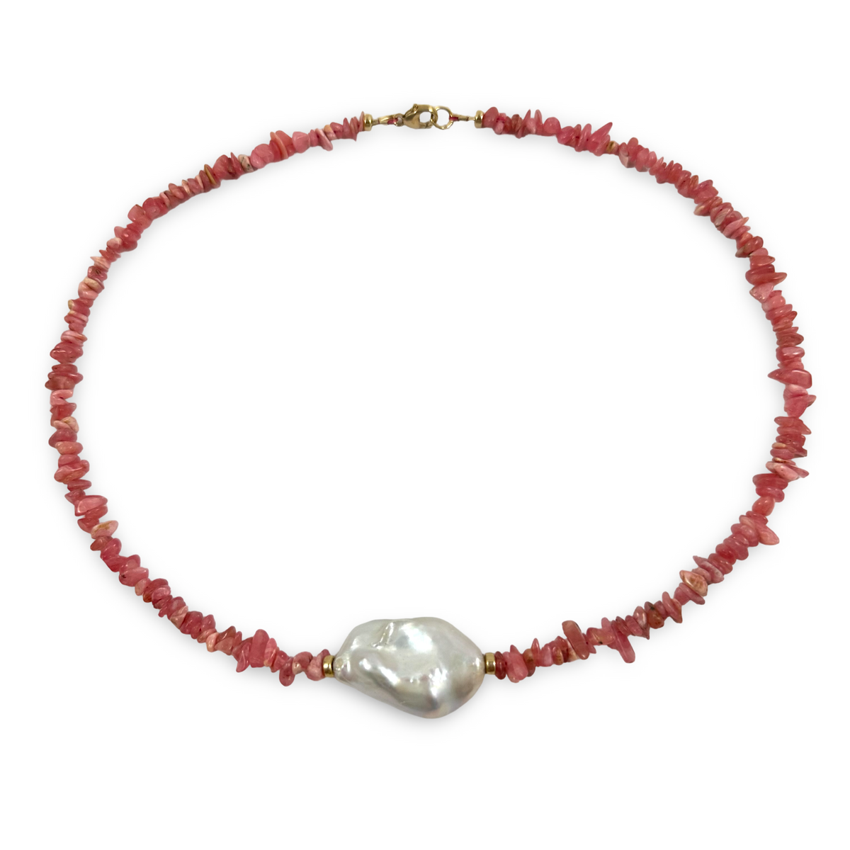 A beaded necklace featuring small, irregular reddish-pink stone chips with a large, lustrous white baroque pearl at the center, finished with a gold-tone clasp.