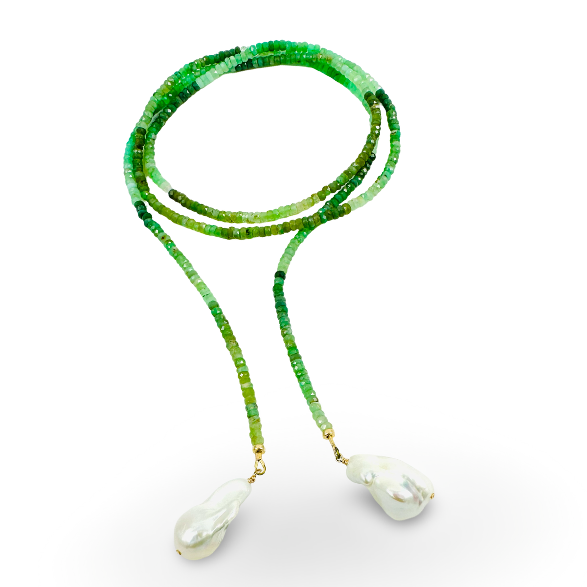 A beaded necklace featuring vibrant green faceted beads on one strand and translucent green beads on a second strand, both ending in large white baroque pearls with gold-toned settings, shown against a plain white background.