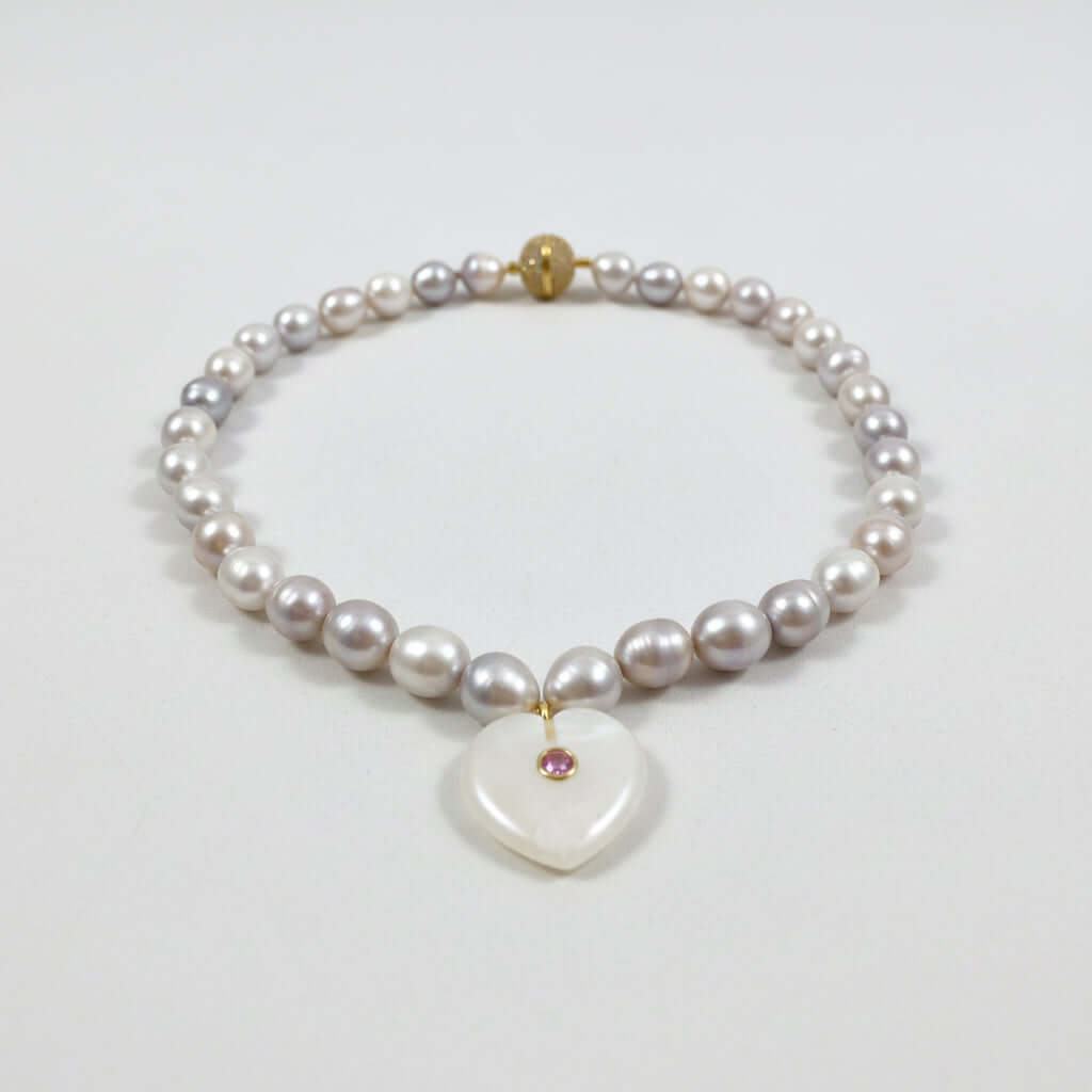 greyish white freshwater pearl choker with a heart pendant and magnetic clasp
