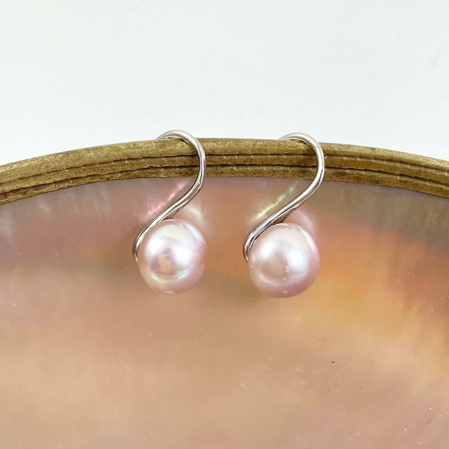 small and classy soft pink pearl earrings, silver settings