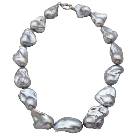 Baroque pearl necklace with silver details, showcasing large, iridescent baroque pearls in an organic design.