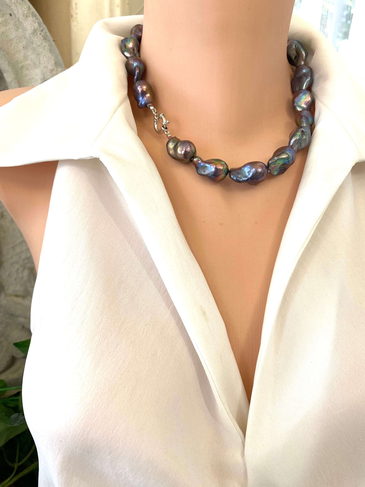 Black Baroque Pearl Necklace featuring unique peacock-black freshwater baroque pearls handcrafted on dark-pink silk.