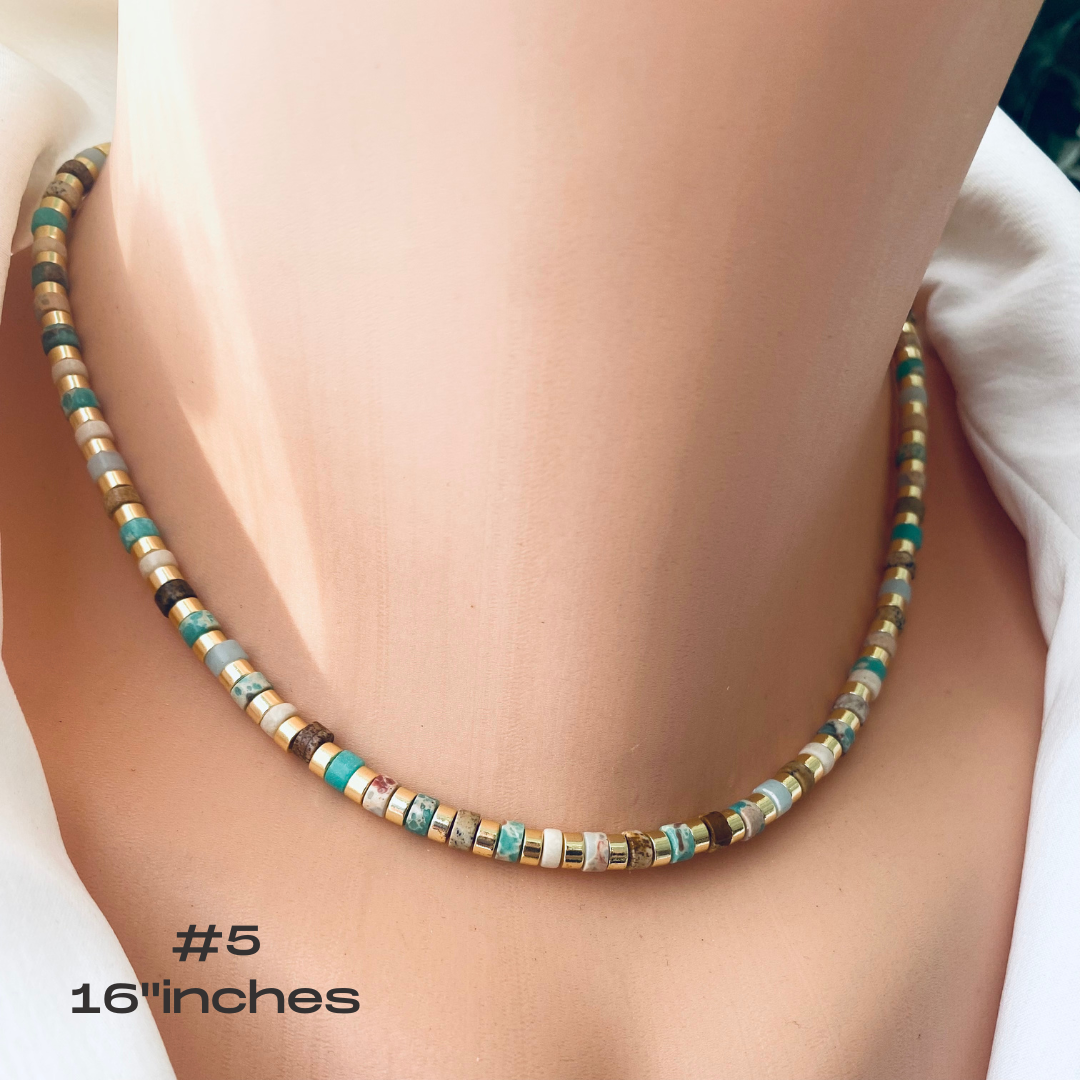 Gemstone choker necklace with multi color beads on display, showcasing vibrant tube-shaped gemstones.