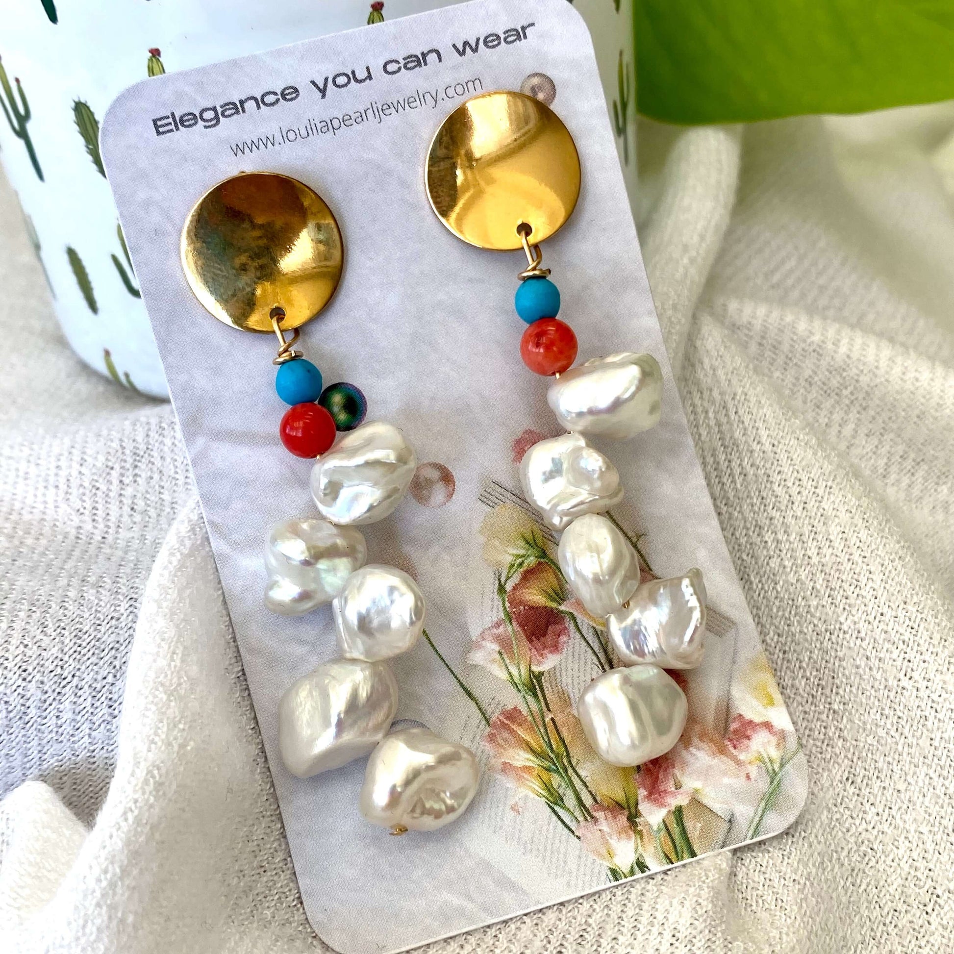 Baroque Keshi Pearl Earrings on branded jewelry packaging, displayed on white fabric with green leaves, handmade in Canada
