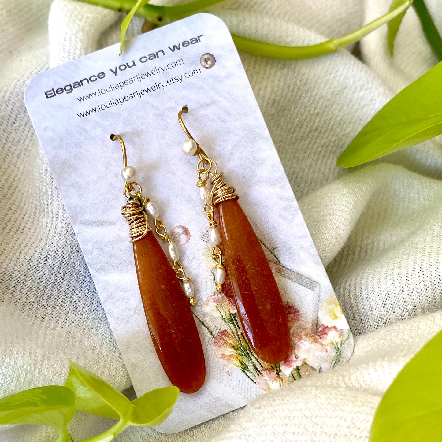 Red Aventurine Pearl Earrings showcasing unique orange-red dangles with pearl accents, handmade and elegant.